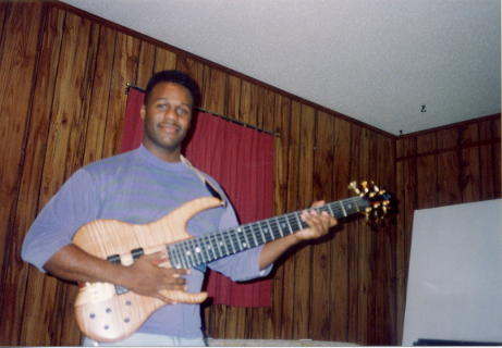 This is the earliest picture I have with me and my then "New" 1993 Ken Smith Bass; photo from the fall of 1993 in Pensacola Florida.  

All my friends were asking why did I spend so much on a bass?  The $3K I used for a 486 33Mhz Computer - that was justified - now in the trash!  

This is a BMT G bass, one of the first ones.  It sounds better every year!  I believe the wood is drying out or something.